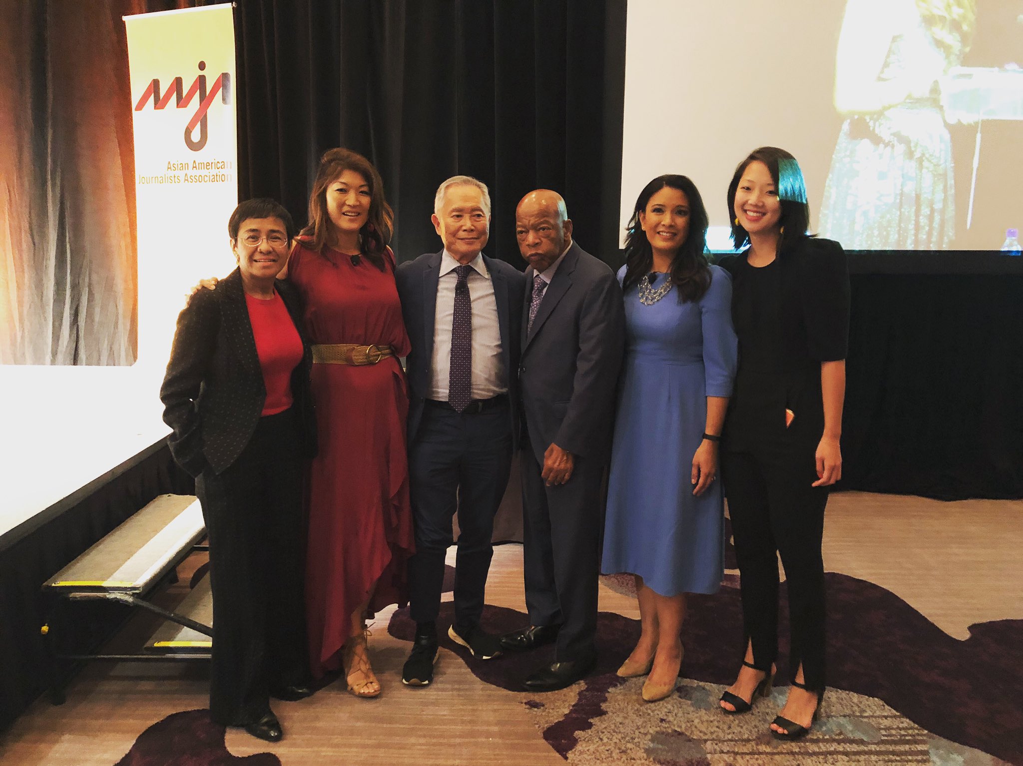 Maria Ressa at the AAJA 2019 Convention in Atlanta, Georgia, standing with from left to right, Juju Chang, George Takei, the late Congressman John Lewis, Elaine Quijano, and Michelle Ye Hee Lee.